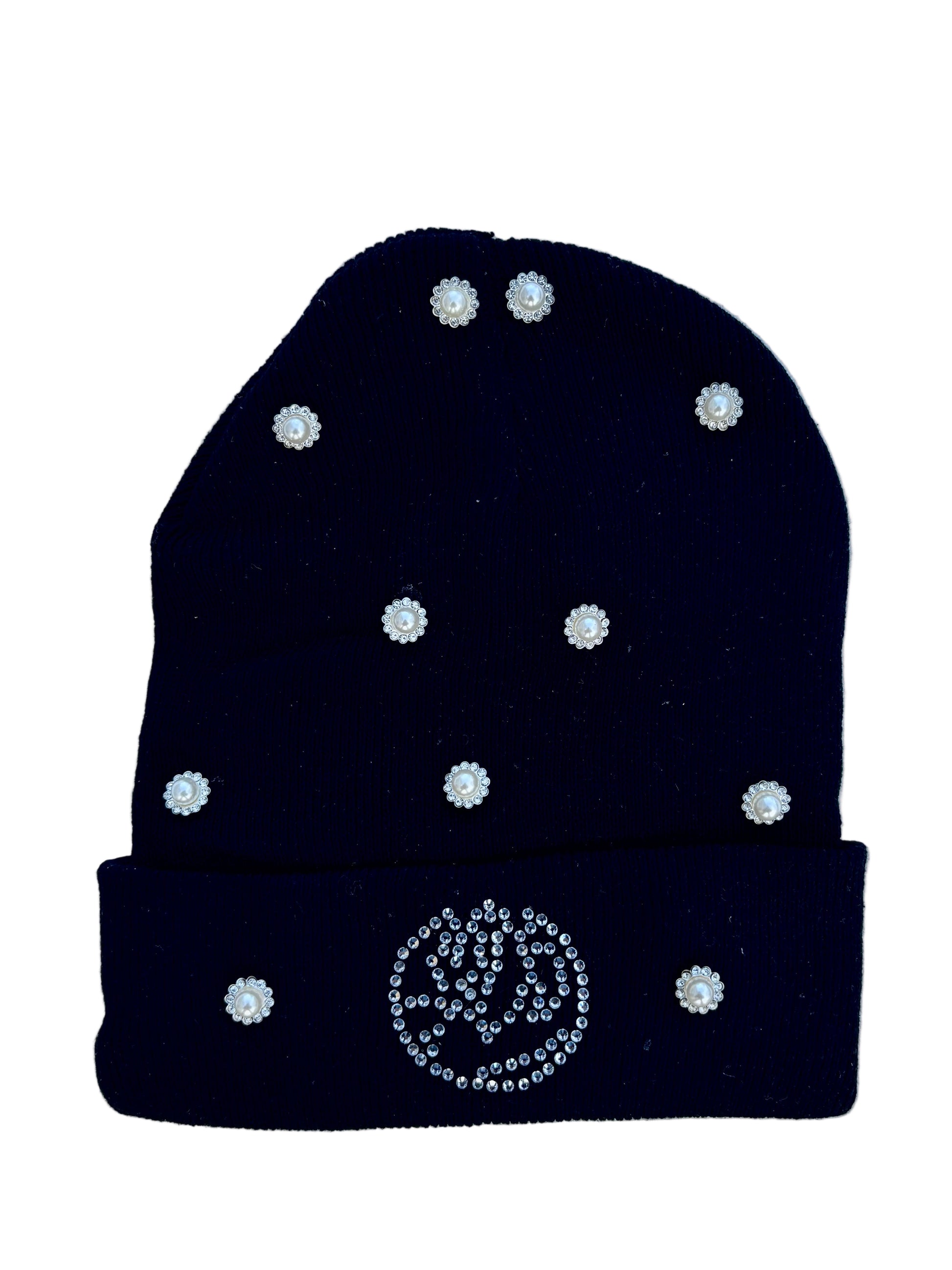 Black beanie with white rhinestone embellishments on a light gray background